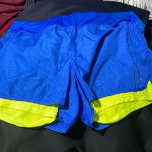 Danskin now semi fitted blue yellow shorts, has been worn but in good quality